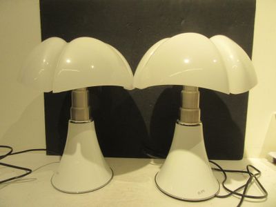 two lamps that are sitting on a table