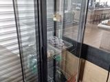 a glass display case in the corner of a store