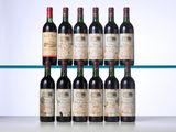six bottles of red wine are lined up on a shelf