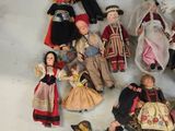 a lot of dolls that are sitting on a table