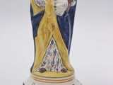 a figurine of a woman holding a child