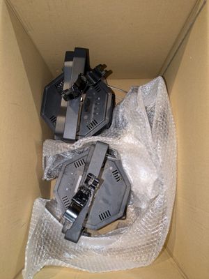 a cardboard box with a couple of electronic devices inside of it
