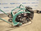 a small lawn mower that is sitting on the ground