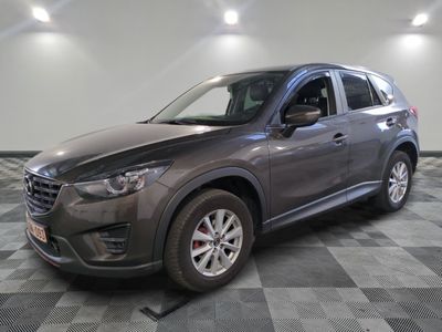 the mazda cx - 5 is parked on a checkered tile floor