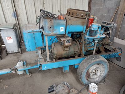 a blue machine that is sitting in a garage