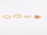 trois bagues en or, dont l'une est sertie d'une pierre rose et l'autre d'un diamant