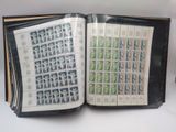 an open book with stamps on it on a table