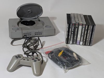 a lot of video games and a game controller on the table