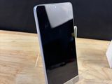 a cell phone that is sitting on a wooden table