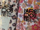 two notebooks that are sitting on a table