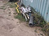 a broken toilet sitting on the side of the road