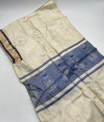 a close up of a towel on a white surface with a blue stripe