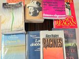 several books are stacked on top of each other on a table