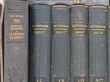 a box full of old books sitting on a table