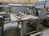 a workbench that has a lot of tools on it
