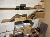 many boxes and boxes on the shelves in the room