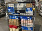 a metal cart with many boxes on it in a store