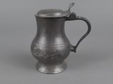 an antique silver plated tankard with a handle and handle