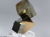a sculpture made of gold and silver cubes on top of clear cubes