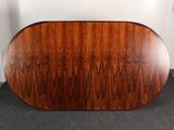 an image of a large wooden table with a curved top