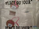 a plastic bag that has two pieces of clothing in it