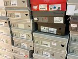 many boxes stacked on top of each other on the floor