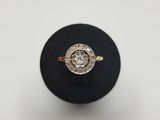 a close up of a diamond ring on a black ring stand