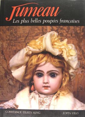 un livre avec l'image d'une petite fille portant un chapeau