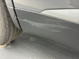 a close up of a car ' s tire on the street