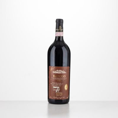 a bottle of red wine sitting on top of a table