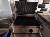a grill that is sitting on a counter in a kitchen