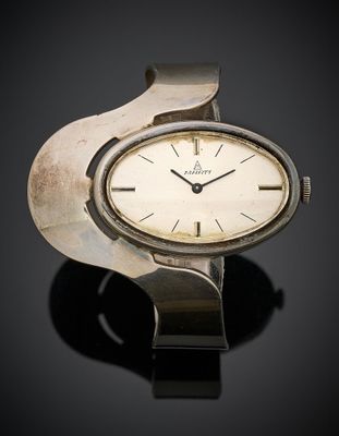 an image of a wrist watch on a black surface
