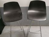 two chairs sitting next to each other in a room
