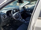 the interior of a car with the door open and the driver ' s seat down