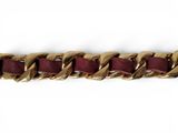 a close up of a gold chain bracelet on a white background