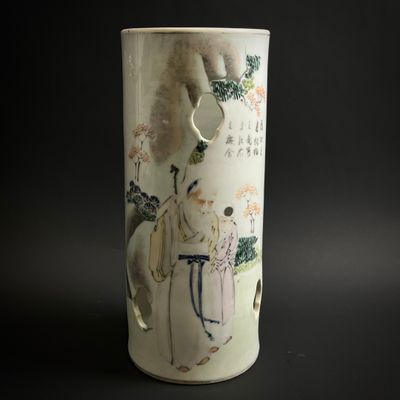 a vase with a picture of a man riding a horse