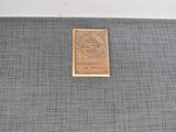 grey fabric with a gold label on the side of it