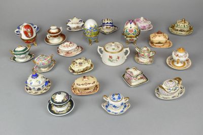 many different types of tea cups and saucers on the table