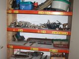 many shelves with tools on them in a room