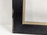 an image of a black frame with a gold border