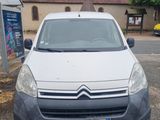 a small white van parked in a parking lot