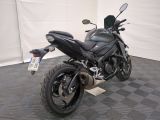 a motorcycle that is parked on the floor in the room