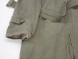 a close up of a military coat with a belt