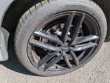 a close up of a tire on a car ' s rim