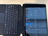 two laptops sitting next to each other on a table