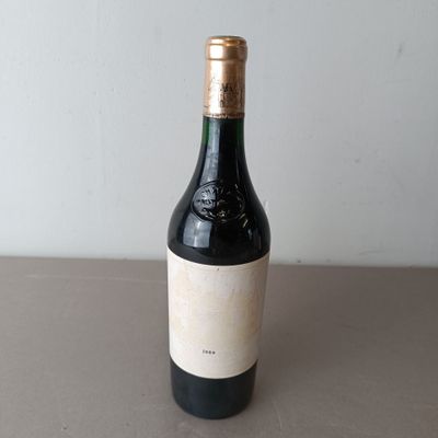 a bottle of wine that is sitting on a table