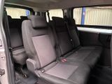 four seats in the back of a van that are empty