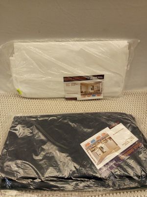 a plastic sheet and a plastic bag on the floor
