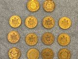 a pile of gold coins sitting on top of a gray towel