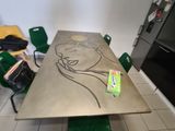 a table with a drawing of a woman on it